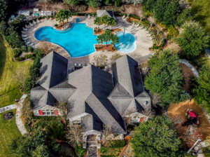 Aerial view of community club house with pool