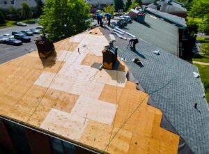 Roof repairs old roof replacement with new shingles of a shared community space