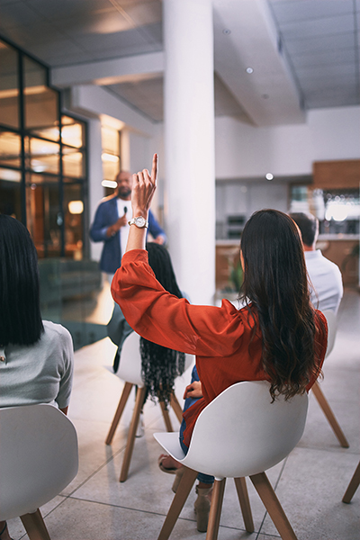woman attending regular board meetings to stay involved in her HOA